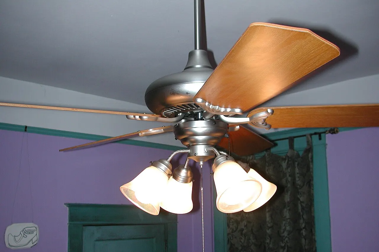 Ceiling fan with light kit in a New Orleans bedroom