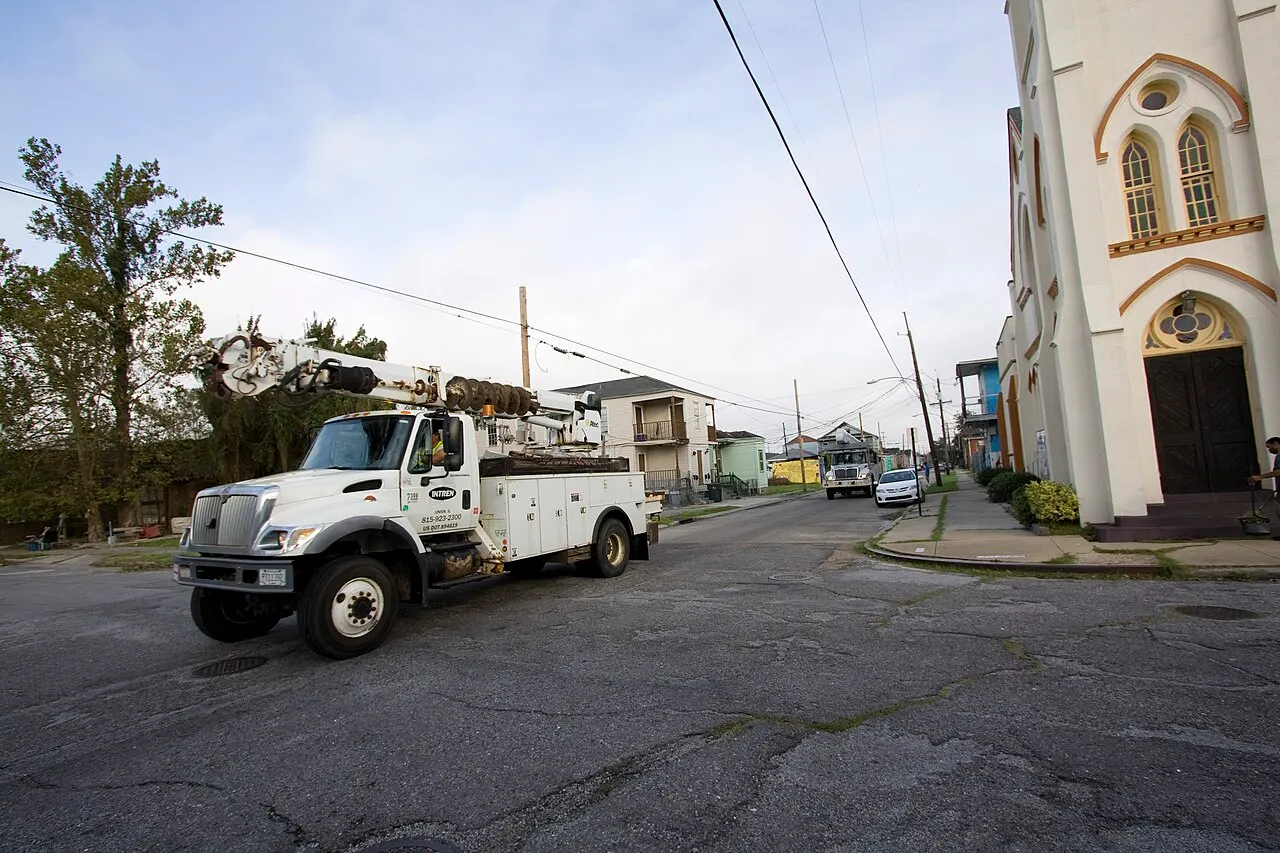 Utility trucks restoring power on a New Orleans street