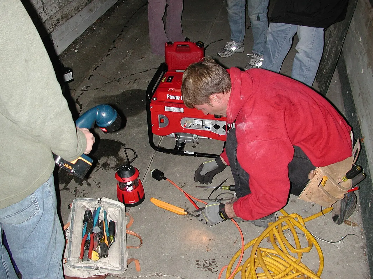 Electrician wiring a portable generator hookup