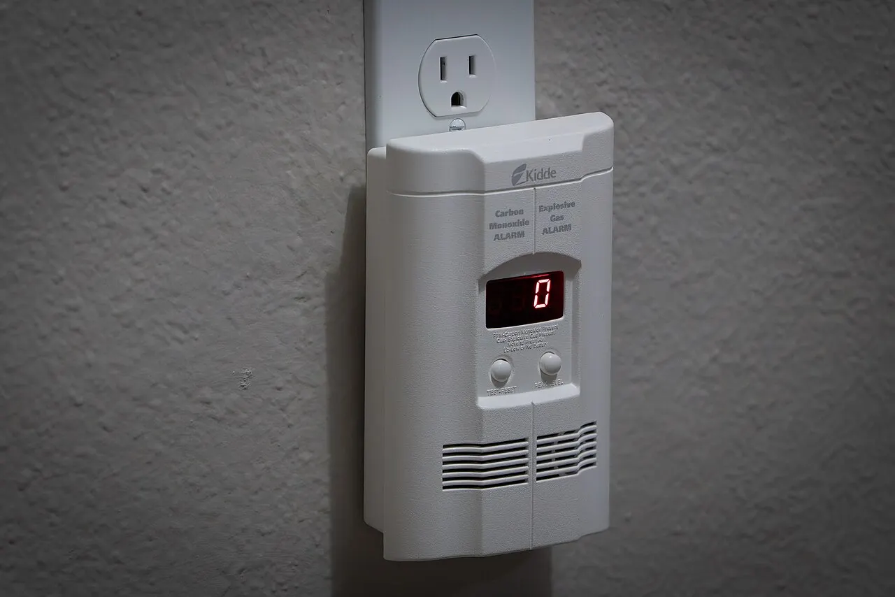 Carbon monoxide alarm plugged into a wall outlet
